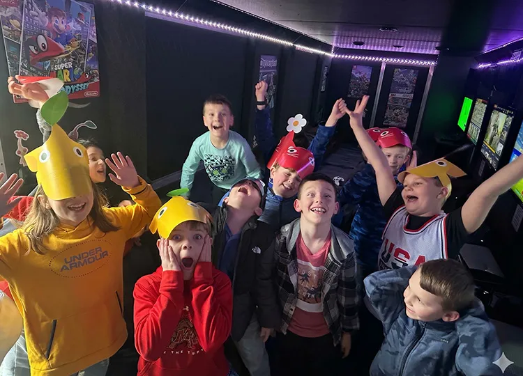Sports team celebrating together in GameTruck mobile gaming theater