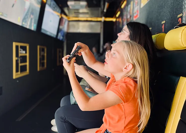 Multi-generational family gaming together at a GameTruck family reunion
