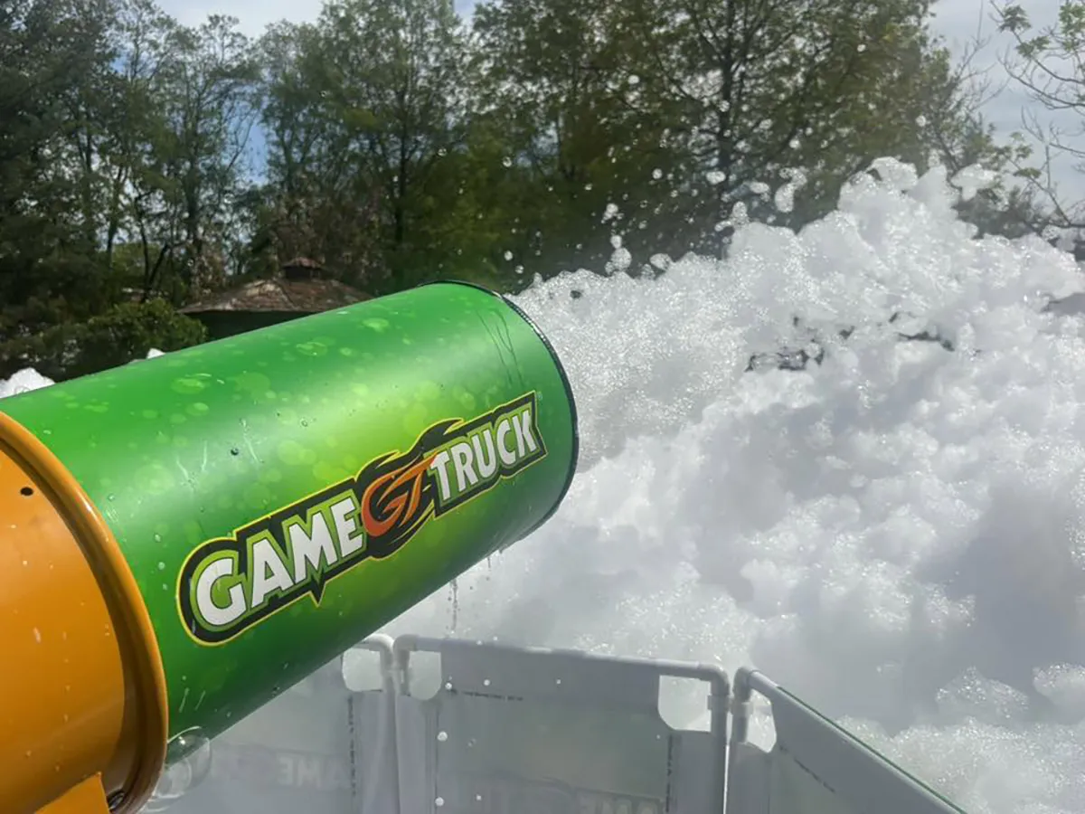 GameTruck Foam Cannon blasting foam at a birthday party with kids laughing and playing
